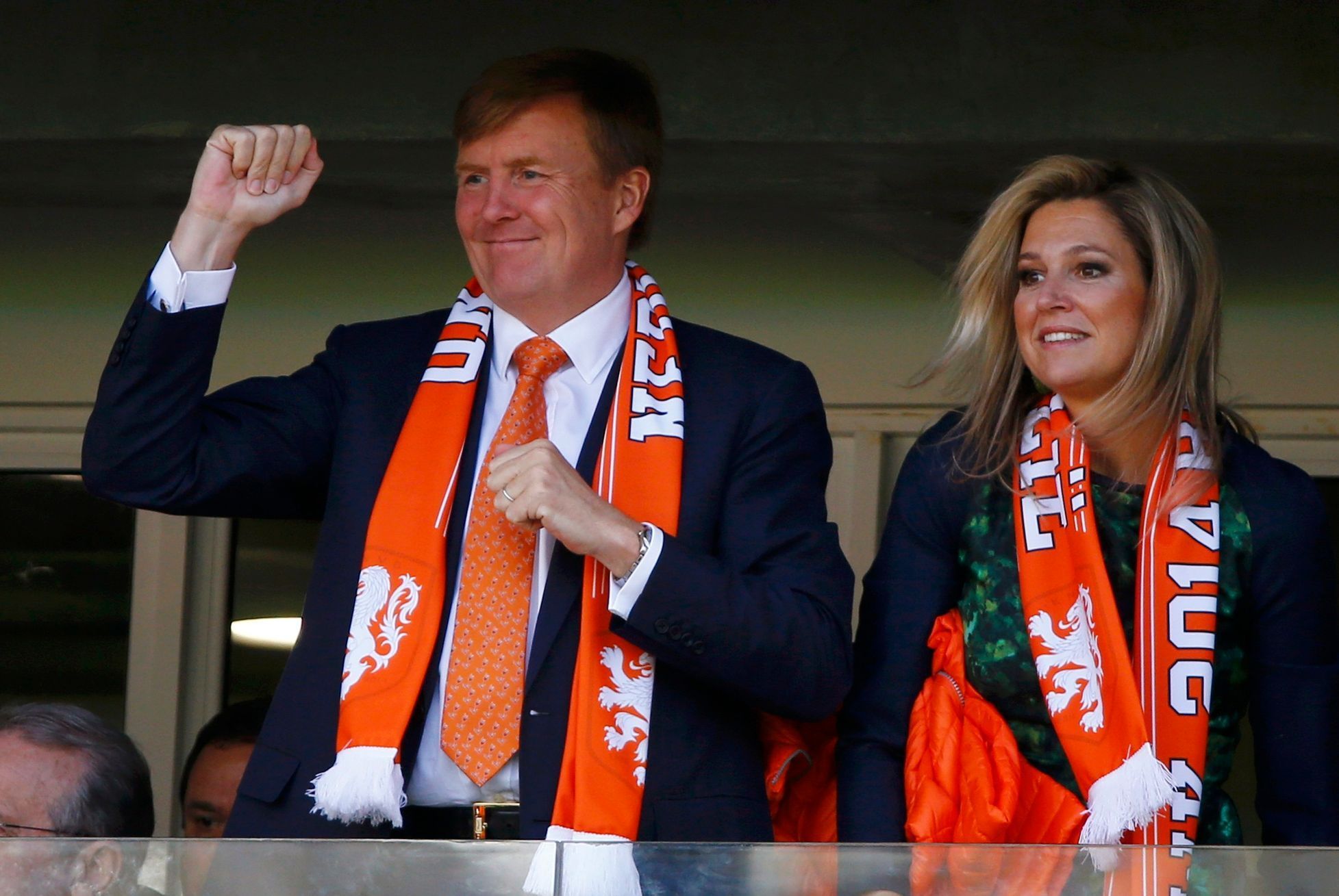 King Willem-Alexander and Queen Maxima of the Netherlands cheer as they watch their 2014 World Cup Group B soccer match against Australia at the Beira Rio stadium in Porto Alegre