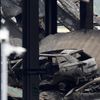 A view shows burnt vehicles in Terminal Car Park 2, following a fire at London Luton Airport, in Luton