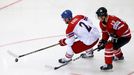 Jakub Kindl of the Czech Republic (L) is chased by Canada's Cody Hodgson (R) during the third period of their men's ice hockey World Championship group A game against Can