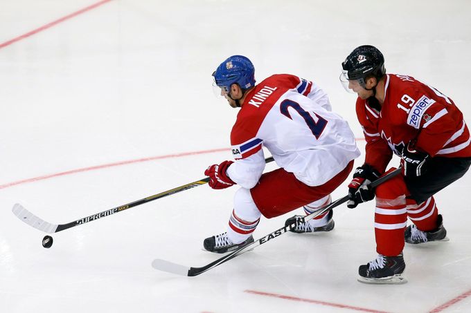Jakub Kindl of the Czech Republic (L) is chased by Canada's Cody Hodgson (R) during the third period of their men's ice hockey World Championship group A game against Can