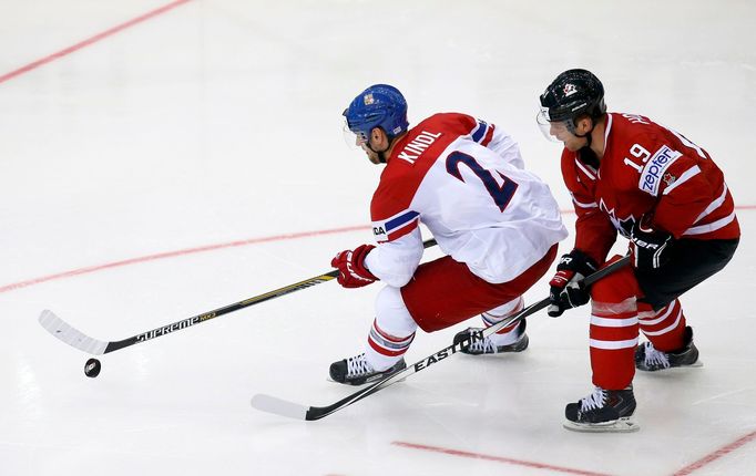 Jakub Kindl of the Czech Republic (L) is chased by Canada's Cody Hodgson (R) during the third period of their men's ice hockey World Championship group A game against Can