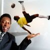 FILE PHOTO: Brazilian soccer legend Pele stands next to a photograph of him by Patrick Lichfield at the opening of the 'Pele Collection' in the County Hall, London
