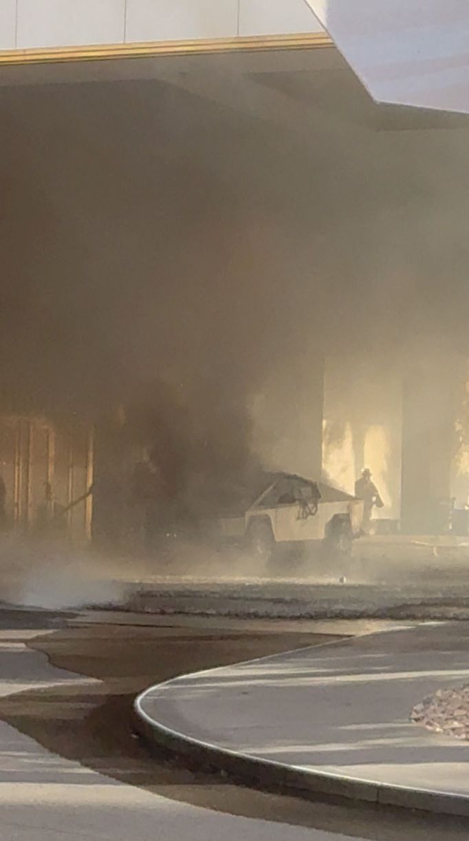 Firefighters work at the scene after a Tesla Cybertruck exploded outside the Trump International Hotel Las Vegas, in Las Vegas, Nevada, U.S., January 1, 2025 in this scre