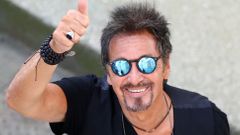 Cast member Al Pacino gestures as he leaves at the end of the photo call for his two movies &quot;The Humbling&quot; and &quot;Manglehorn&quot; at the 71st Venice Film Festival