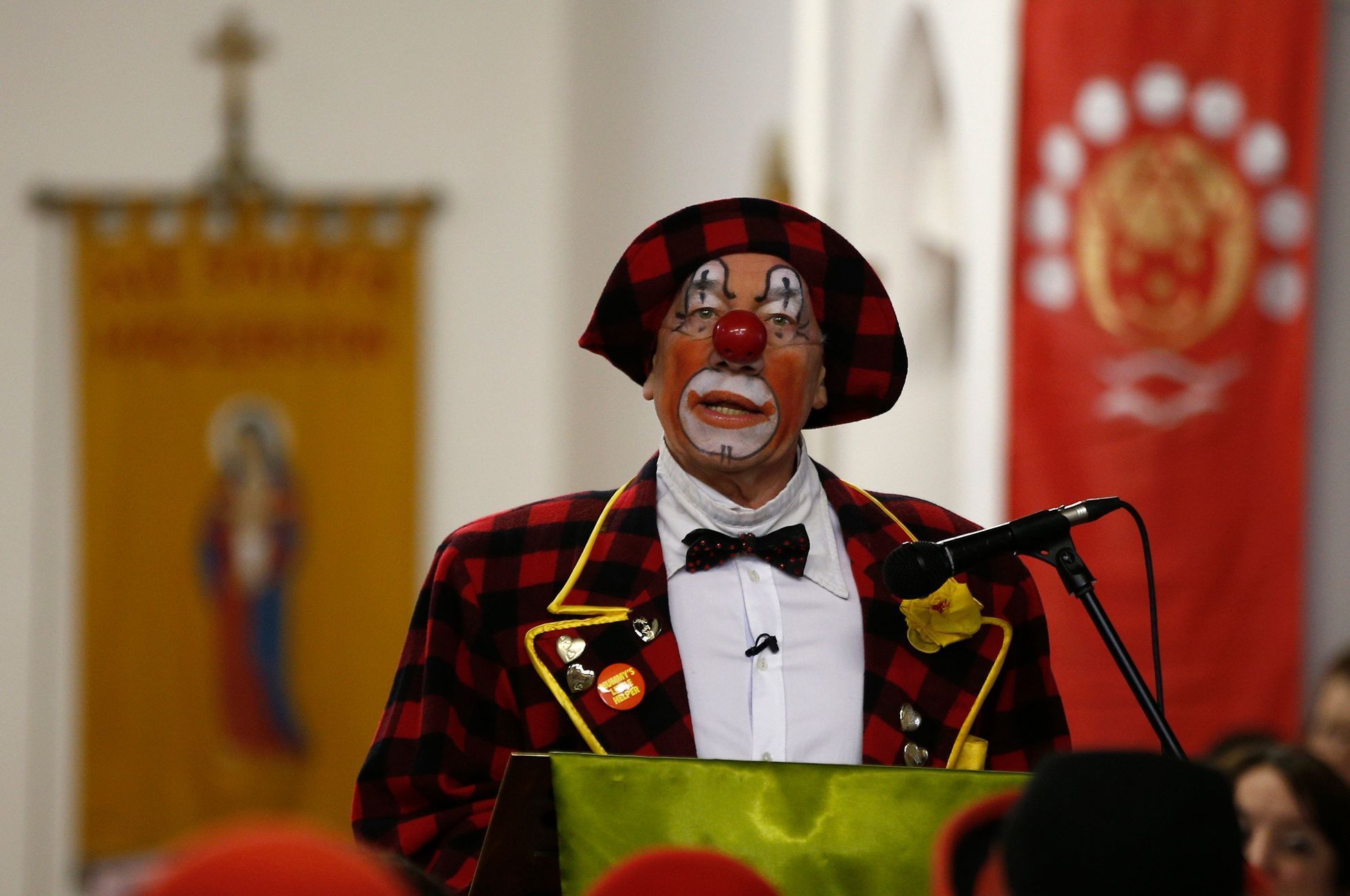 British actor Callow pauses during a reading, while dressed as clown at the All Saints Church during the Grimaldi clown service in Dalston, north London