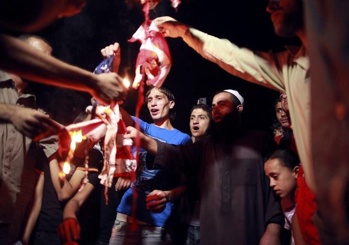 Palestinian Salafists burn a U.S flag during a protest against what they said was a film being produced in the United States that was insulting to the Prophet Mohammad, in Gaza City September 13, 2012.