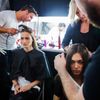 Models have their hair done backstage before presenting the BCBG Max Azria collection during New York Fashion Week