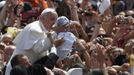 Pope Francis kisses a baby at the end of a canonization mass in Saint Peter's Square at the Vatican May 12, 2013. The Pope led a mass on Sunday for candidates for sainthood Antonio Primaldo, Mother Laura Montoya and Maria Guadalupe Garcia Zavala.