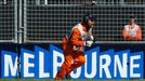 A race marshall picks up debris during the Australian F1 Grand Prix at the Albert Park circuit in Melbourne March 15, 2015. REUTERS/Brandon Malone (AUSTRALIA - Tags: SPOR