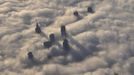 The tops of high rise buildings stick out from a blanket of think fog covering Warsaw early morning October 12, 2012. Picture taken October 12, 2012. REUTERS/Mateusz Olszowy (POLAND - Tags: CITYSPACE ENVIRONMENT TPX IMAGES OF THE DAY) Published: Lis. 21, 2012, 3:44 odp.