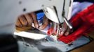 Tailor Abdoulay Cissuma sews a French flag at the central market in Bamako January 24, 2013. A split emerged on Thursday in the alliance of Islamist militant groups occupying northern Mali as French and African troops prepared a major ground offensive aimed at driving al Qaeda and its allies from their safe haven in the Sahara. REUTERS/Malin Palm (MALI - Tags: POLITICS CIVIL UNREST SOCIETY CONFLICT) Published: Led. 24, 2013, 6:52 odp.