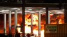 Flames are seen as emergency services respond to a fire in Terminal Car Park 2 at London Luton airport in Luton, Britain, October 10, 2023.  REUTERS/Peter Cziborra