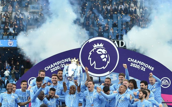 Soccer Football - Premier League - Manchester City v Everton - Etihad Stadium, Manchester, Britain - May 23, 2021 Manchester City's Fernandinho lifts the trophy as they c