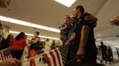 Luis Salgado (R), nicknamed Chucho, is reunited after ten years with his father, Jesus Salgado (C), and his half brother Kevin, after Luis arrived from Havana at Miami airport, March 13, 2013. Chucho was granted a U.S. visa based on his father's status as legal resident in Texas, and he was reunited in Miami with his father, who had escaped Cuba on a frail boat ten years earlier. The Salgados are among many Cubans taking advantage of Cuba's new travel policy in place since last January, which allows citizens to leave the country with just a passport and no need for much-hated exit visas required since 1961. Picture taken March 13, 2013. REUTERS/Desmond Boylan (UNITED STATES - Tags: POLITICS SOCIETY) Published: Dub. 11, 2013, 1:30 odp.