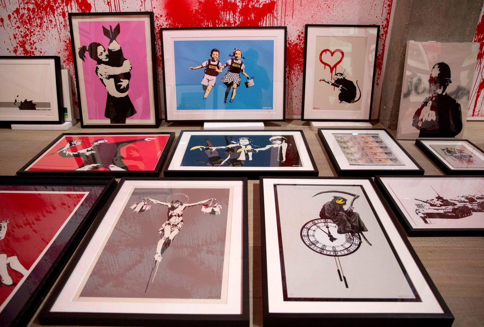 Art pieces wait to be hung at the Banksy: The Unauthorised Retrospective exhibition at Sotheby's S2 Gallery in London