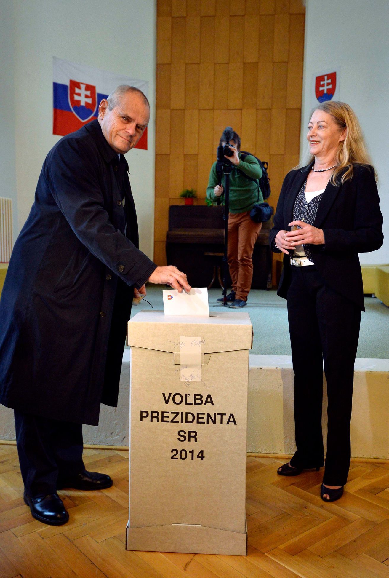 Slovakia's presidential candidate Knazko and his wife cast their ballots at a polling station during the first round presidential elections in Bratislava