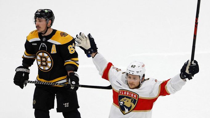 Apr 19, 2023; Boston, Massachusetts, USA; Florida Panthers defenseman Brandon Montour (62) celebrates his goal as Boston Bruins left wing Brad Marchand (63) skates away d