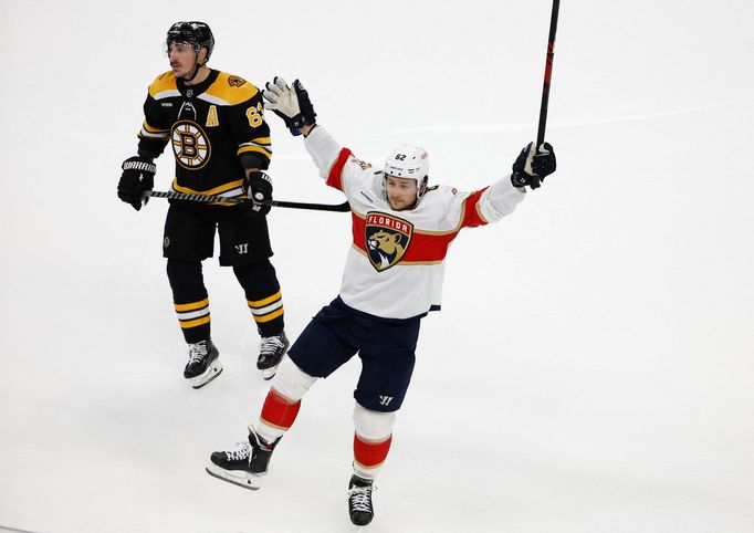 Apr 19, 2023; Boston, Massachusetts, USA; Florida Panthers defenseman Brandon Montour (62) celebrates his goal as Boston Bruins left wing Brad Marchand (63) skates away d