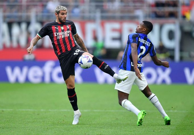 Soccer Football - Serie A - AC Milan v Inter Milan - San Siro, Milan, Italy - September 3, 2022 AC Milan's Theo Hernandez in action with Inter Milan's Denzel Dumfries REU