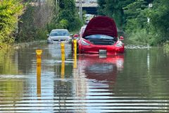 Cars are stranded in a flooded section of Bayview Avenue after heavy rains hit Toronto, Ontario, Canada July 16, 2024.  REUTERS/Kyaw Soe Oo