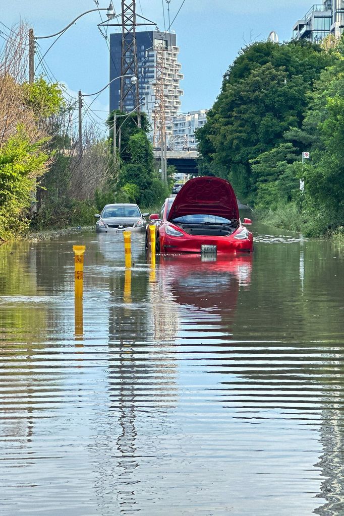 Cars are stranded in a flooded section of Bayview Avenue after heavy rains hit Toronto, Ontario, Canada July 16, 2024.  REUTERS/Kyaw Soe Oo