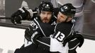 Los Angeles Kings' Drew Doughty (L) celebrates his goal on New York Rangers goalie Henrik Lundqvist with teammate Kyle Clifford during the second period in Game 1 of thei