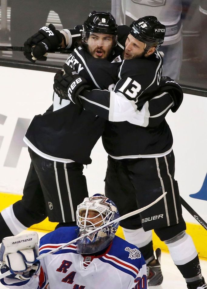 Los Angeles Kings' Drew Doughty (L) celebrates his goal on New York Rangers goalie Henrik Lundqvist with teammate Kyle Clifford during the second period in Game 1 of thei