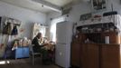 Villager Shamianok has breakfast in his house at abandoned village of Tulgovichi