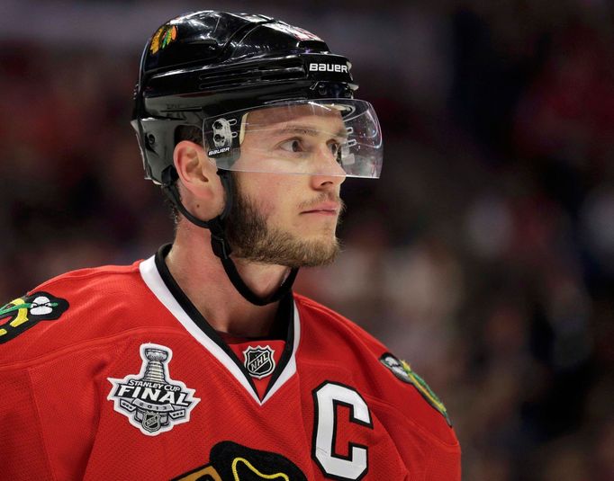 Chicago Blackhawks center Jonathan Toews (19) looks out from his helmet against the Boston Bruins during Game 1 of their NHL Stanley Cup Finals hockey series in Chicago,