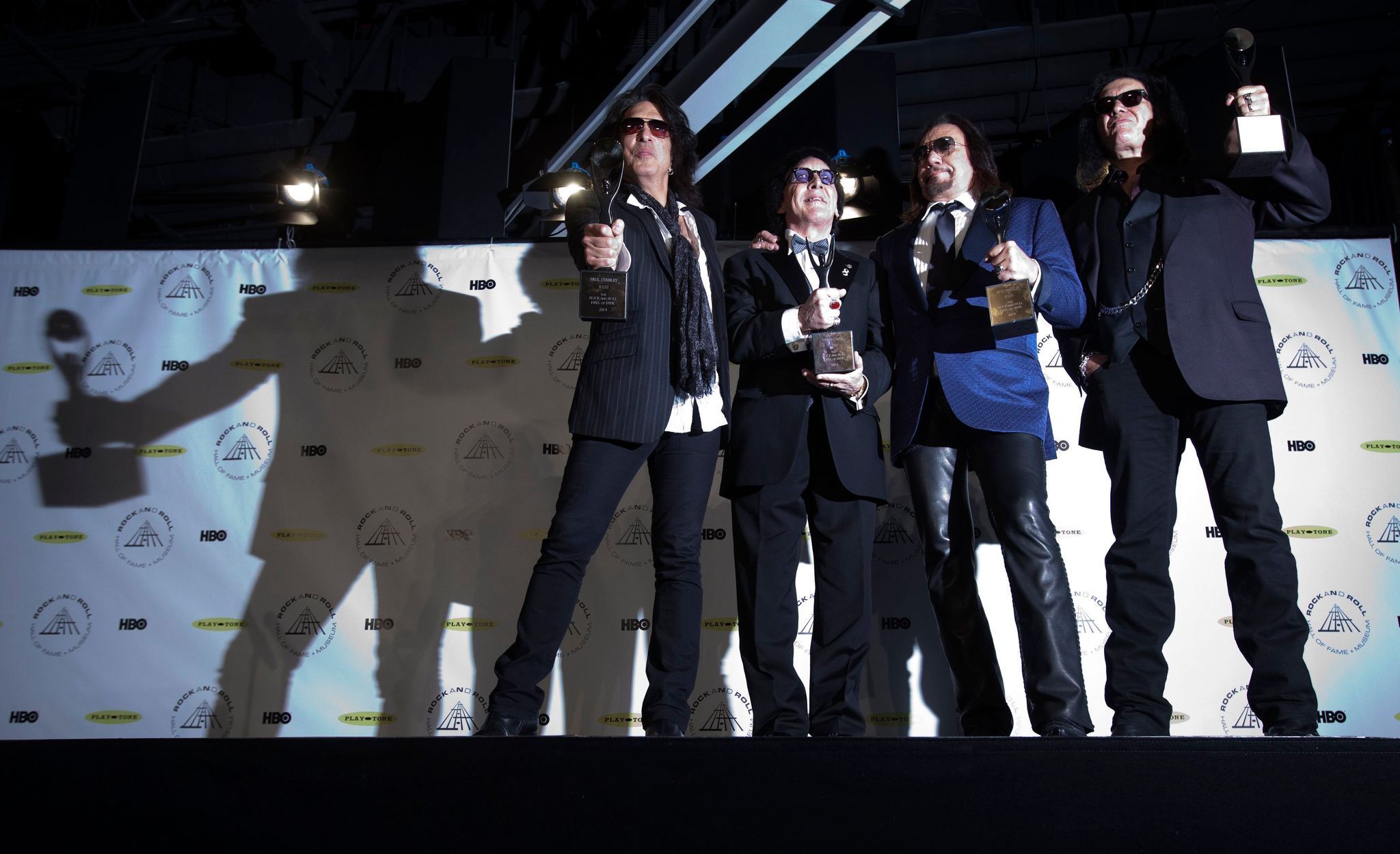 Kiss band members pose with their awards after the rock band was inducted at the 29th annual Rock and Roll Hall of Fame Induction Ceremony in Brooklyn