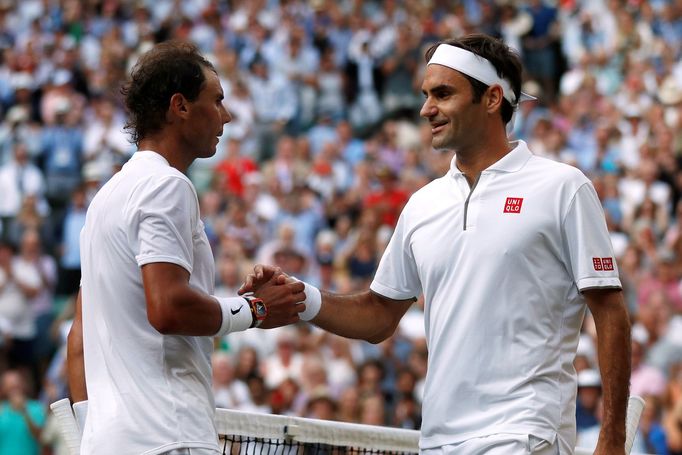 Tennis - Wimbledon - All England Lawn Tennis and Croquet Club, London, Britain - July 12, 2019  Switzerland's Roger Federer with Spain's Rafael Nadal after winning their