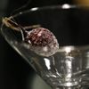 A microphone is concealed inside an artificial cherry placed in a martini glass at the 'Top Secret' Spy Museum in Oberhausen, July 10, 2013. The museum presents various objects, devices and gadgets used for spying or related to espionage. REUTERS/Ina Fassbender (GERMANY - Tags: SOCIETY ENTERTAINMENT TPX IMAGES OF THE DAY) Published: Čec. 10, 2013, 3:17 odp.