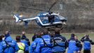 French Police and Gendarmerie Alpine rescue units gather on a field as they prepare to reach the crash site of an Airbus A320