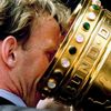 FILE PHOTO: Andreas Brehme from the German soccer cup winner FC Kaiserslautern drinks out of the cup during the ..
