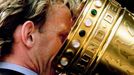 FILE PHOTO: Andreas Brehme from the German soccer cup winner FC Kaiserslautern drinks out of the cup during the victory ceremony for the Kaiserslautern soccer team in Kai