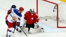 Russia's Vadim Shipachyov (L) scores in front of Switzerland's goalkeeper Leonardo Genoni (R) during the second period of their men's ice hockey World Championship Group