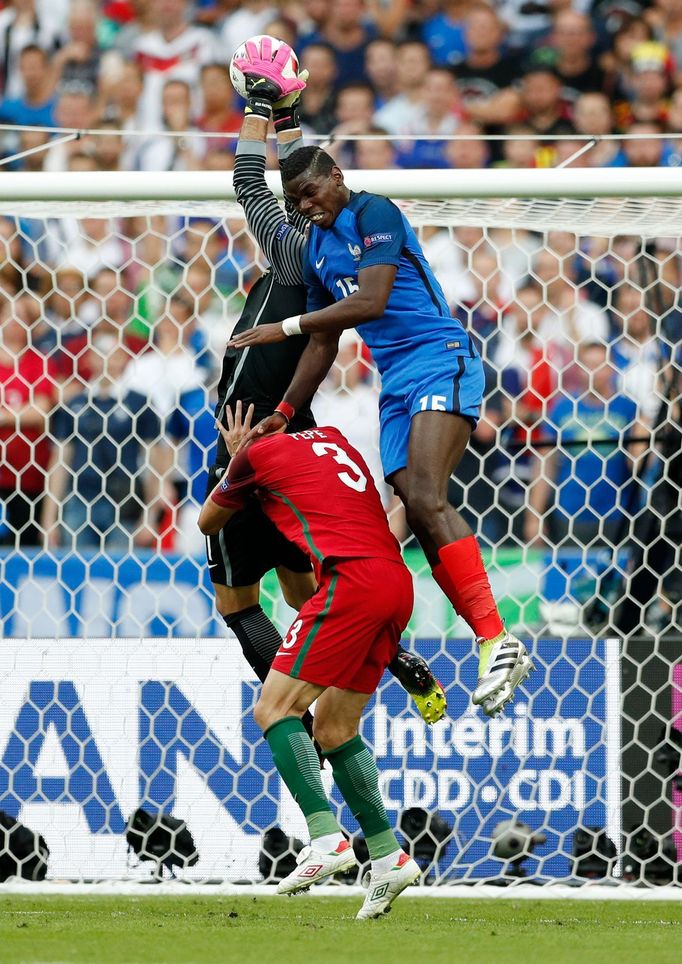 Portugal's Pepe and Rui Patricio in action with France's Paul Pogba