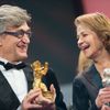 Director Wenders holds an Honorary Golden Bear next to actress Rampling holding her Silver Bear for Best Actress for the film '45 Years' at the awards ceremony of the 65th Berlinale International Film