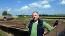 O GO WITH AFP STORY by ANNA MARIA JAKUBEK - Grzegorz Skalmowski, owner of the "Snail Garden", poses at his farm in Krasin, northern Poland, on May 29, 2013.