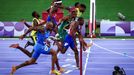 Paris 2024 Olympics - Athletics - Men's 100m Final - Stade de France, Saint-Denis, France - August 04, 2024. Noah Lyles of United States crosses the line to win gold. REU