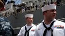 April 25, 2011 - Fort Lauderdale, Florida, U.S. - -- Fort Lauderdale, Fla. -- Submariners Maxime Therrault, 22, left, of Massachusetts, and Christopher Speer, of the USS Annapolis (SSN 760), a S6G nuclear reactor powered fast attack submarine, while moored along side the USS Ross, a guided missile destroyer, at Port Everglades in Fort Lauderdale on Monday. The USS Annapolis measures 362 ft. in length and 33 ft. at the beam, a diving depth of over 400 ft., 27+ mph, 12 vertical launch missile tubes, 4 torpedo tubes, and a crew of 130 enlisted submariners. The submarine was commissioned April 11, 1992 with its homeport in Groton, Connecticut. USS Annapolis sailed to the 21st Anniversary of Fleet Week at Port Everglades, Fort Lauderdale. (Credit Image: © Gary Coronado/The Palm Beach Post)