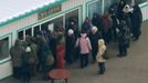 North Koreans gather under a sign that advertises cooked chestnuts and sweet potatoes in Pyongyang, in this photo taken by Kyodo December 12, 2012. Isolated and impoverished North Korea launched its second long- range rocket of 2012 on Wednesday and may have finally succeeded in putting a satellite into space, the stated aim of what critics say is a disguised ballistic missile test. REUTERS/Kyodo (NORTH KOREA - Tags: MILITARY POLITICS) FOR EDITORIAL USE ONLY. NOT FOR SALE FOR MARKETING OR ADVERTISING CAMPAIGNS. THIS IMAGE HAS BEEN SUPPLIED BY A THIRD PARTY. IT IS DISTRIBUTED, EXACTLY AS RECEIVED BY REUTERS, AS A SERVICE TO CLIENTS. MANDATORY CREDIT. JAPAN OUT. NO COMMERCIAL OR EDITORIAL SALES IN JAPAN. YES