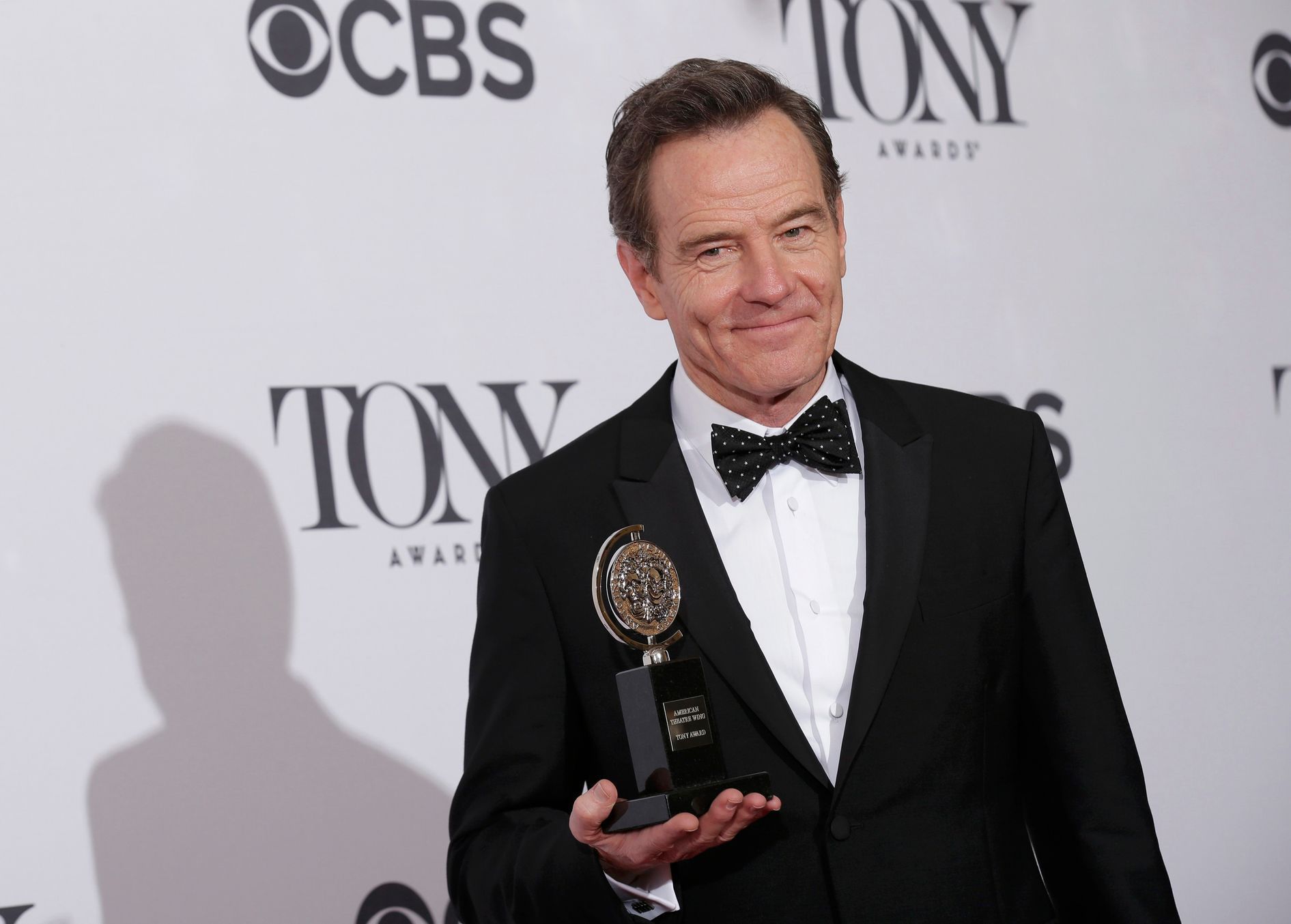 Actor Bryan Cranston poses backstage with his Tony Award at the American Theatre Wing's 68th annual Tony Awards at Radio City Music Hall in New York