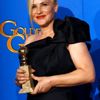 Patricia Arquette poses with her award for Best Supporting Actress in a Motion Picture for her role in &quot;Boyhood&quot; backstage at the 72nd Golden Globe Awards in Beverly Hills