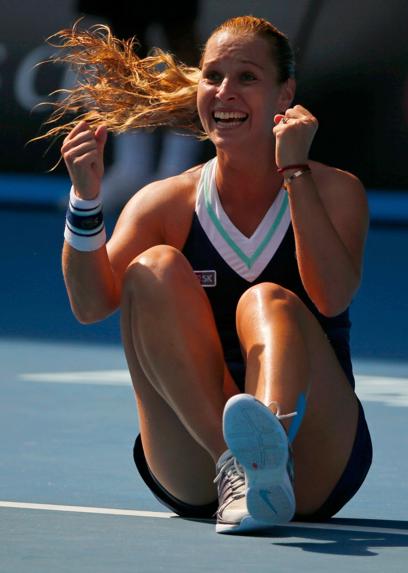 Dominika Cibulkova of Slovakia celebrates defeating Agnieszka Radwanska of Poland in their women's singles semi-final match at the Australian Open 2014 tennis tournament in Melbourne