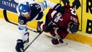 Latvia's Juris Stals (R) and Finland's Jere Karalahti (L) fall after a collision during the second period of their men's ice hockey World Championship group B game at Min