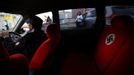 A swastika is seen on the seat of a car belonging to Ariunbold, leader of the Mongolian neo-Nazi group Tsagaan Khass, as he drives along a busy street in Ulan Bator June 22, 2013. The group has rebranded itself as an environmentalist organisation fighting pollution by foreign-owned mines, seeking legitimacy as it sends Swastika-wearing members to check mining permits. Over the past years, ultra-nationalist groups have expanded in the country and among those garnering attention is Tsagaan Khass, which has recently shifted its focus from activities such as attacks on women it accuses of consorting with foreign men to environmental issues, with the stated goal of protecting Mongolia from foreign mining interests. This ultra-nationalist group was founded in the 1990s and currently has 100-plus members. Picture taken June 22, 2013. REUTERS/Carlos Barria (MONGOLIA - Tags: POLITICS ENVIRONMENT BUSINESS SOCIETY EMPLOYMENT) ATTENTION EDITORS: PICTURE 12 OF 25 FOR PACKAGE 'MONGOLIA'S ENVIRONMENTAL NEO-NAZIS'. TO FIND ALL IMAGES SEARCH 'TSAGAAN KHASS' Published: Čec. 2, 2013, 9:58 dop.