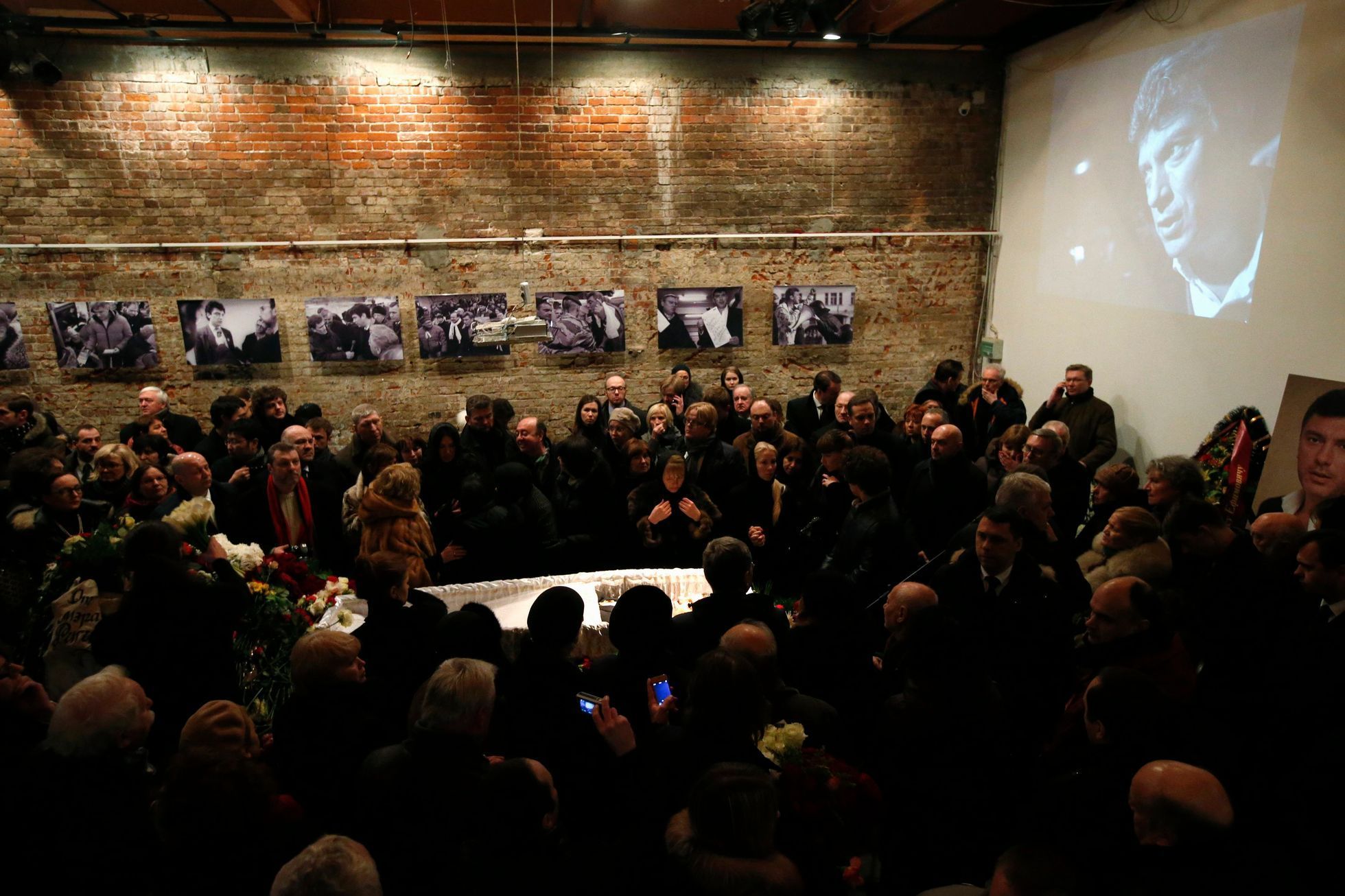 People surround the coffin during a memorial service before the funeral of Russian leading opposition figure Boris Nemtsov in Moscow