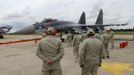 Engineers surround a Sukhoi Su-35 fighter with special vectored thrust jet engines before a flying display, two days before the Paris Air Show, at the Le Bourget airport near Paris, June 15, 2013. The Paris Air Show runs from June 17 to 23. REUTERS/Pascal Rossignol (FRANCE - Tags: BUSINESS AIR TRANSPORT DEFENCE)