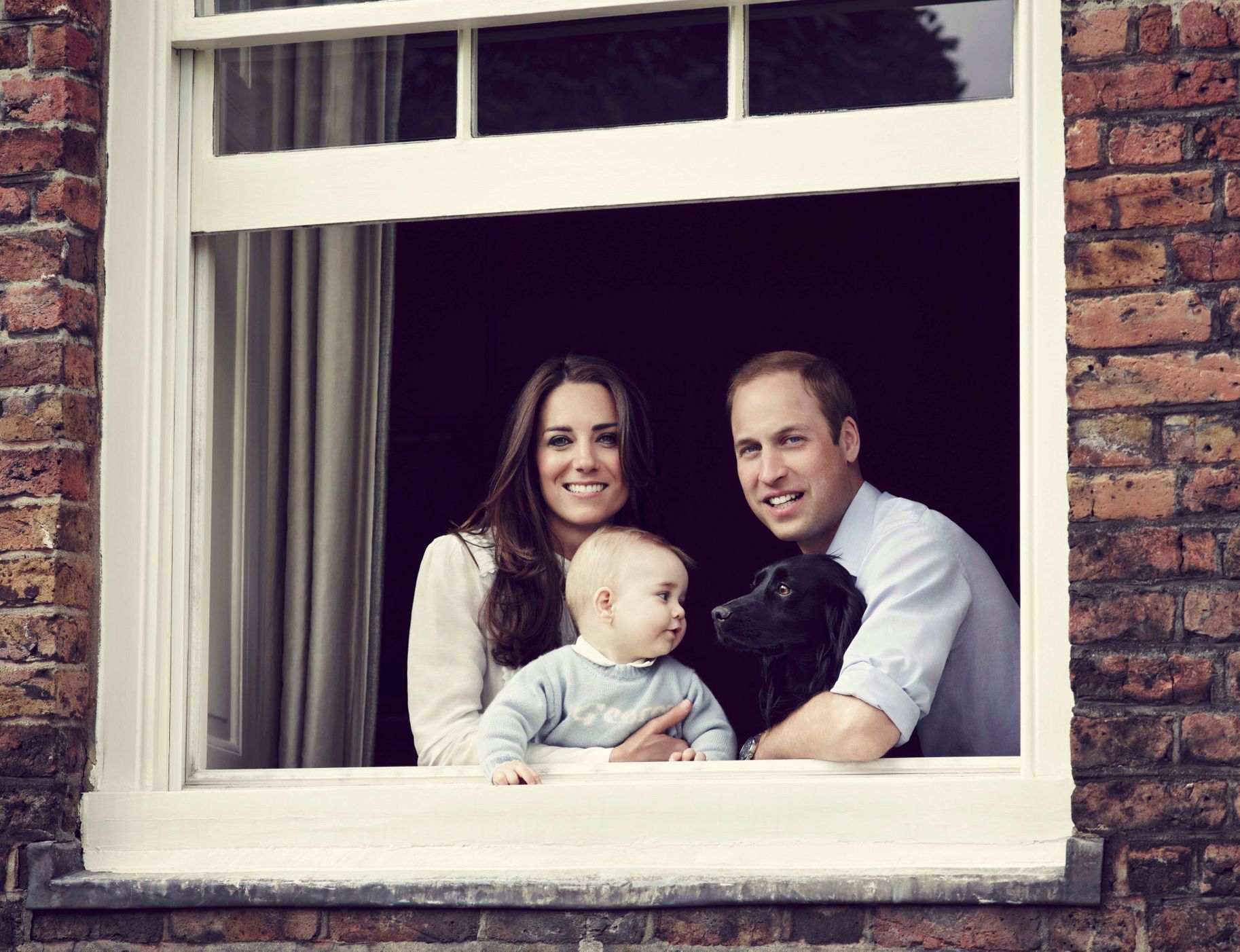 Britain's Prince William, Catherine, Duchess of Cambridge and their son Prince George, are seen in this photograph taken in Kensington Palace, London